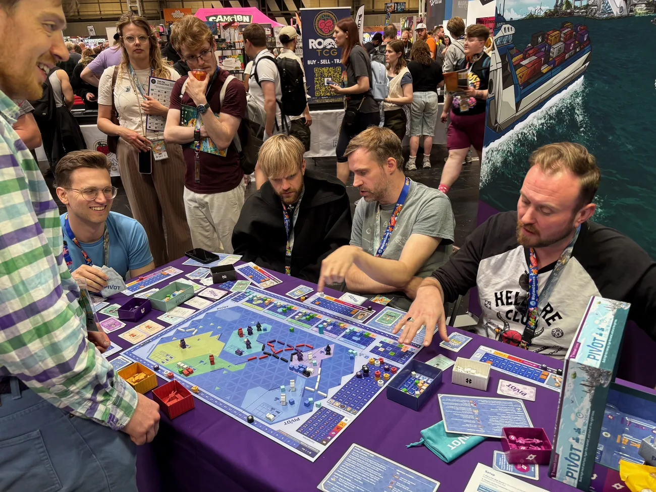 A busy crowd gathered around a game of Pivot at UK Games Expo